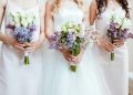 cropped shot of bride with bridesmaids holding bouquets