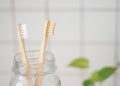 two toothbrush in mason jar