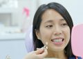 Woman go dental clinic for whitening teeth