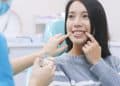 Woman talk to dentist in dental clinic